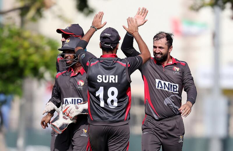 DUBAI, UNITED ARAB EMIRATES , Dec 12– 2019 :- Rohan Mustafa of UAE (right) celebrating after taking the wicket of Steven Taylor during the World Cup League 2 cricket match between UAE vs USA held at ICC academy in Dubai. ( Pawan Singh / The National )  For Sports. Story by Paul