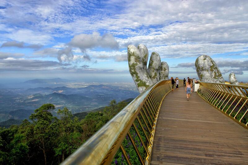 Nestled in the forested hills of central Vietnam two giant concrete hands emerge from the trees. AFP Photo