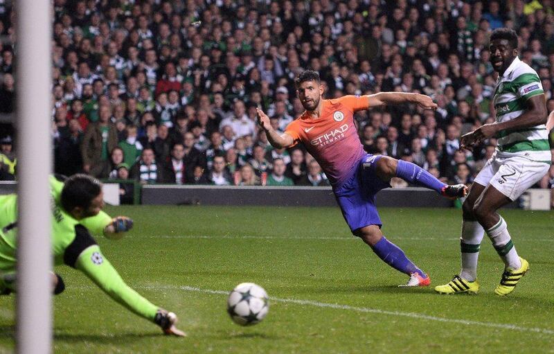 Manchester City’s Sergio Aguero, centre, shoots towards Celtic goalkeeper Craig Gordon, left, but the ball rebounds to Manchester City’s Nolito (unseen) leading to their third goal. Oli Scarff / AFP
