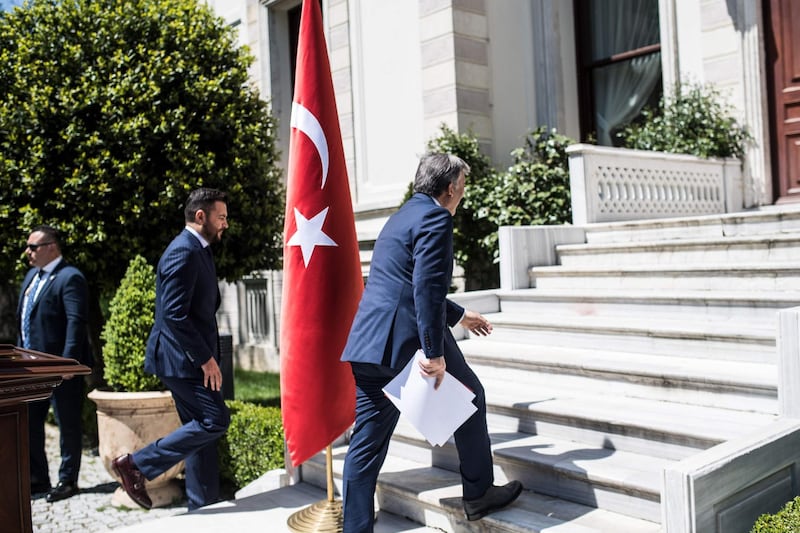 Former Turkish head of state Abdullah Gul climbs stairs as he leaves after a press conference on April 28, 2018, in Istanbul.
Gul on April 28, 2018 ruled out running for the presidency in June, dousing fevered speculation he would challenge current President. The polls are significant because under constitutional changes approved in an April 2017 referendum, Turkey will be run under an executive presidency with boosted powers for the head of state. / AFP PHOTO / BULENT KILIC