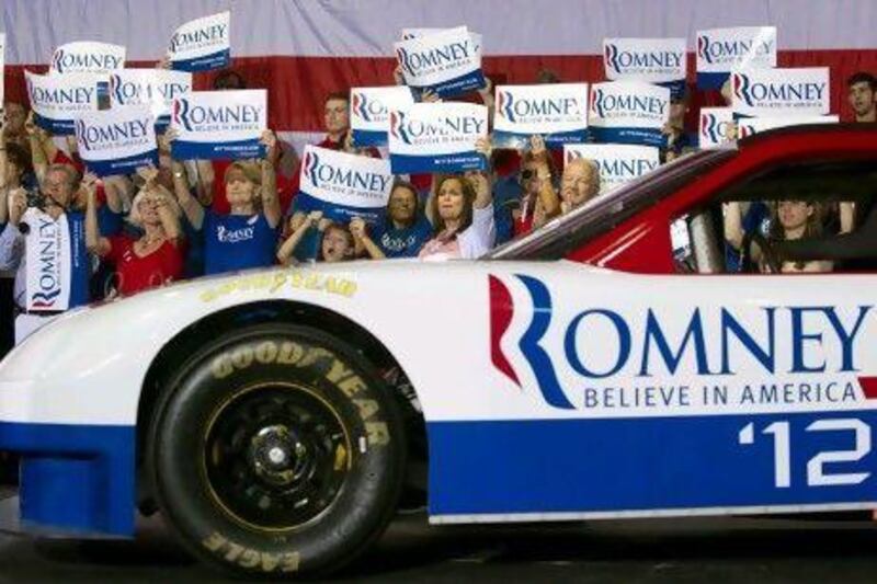 Supporters of US Republican presidential candidate Mitt Romney await his arrival for a campaign rally at the Nascar Technical Institute in Mooresville, North Carolina in August. Saul Loeb / AFP