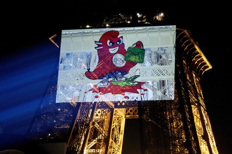 Olympic Games mascot Phryges is projected on to the Eiffel Tower in Paris during a protest against LVMH by animal rights group Peta. AFP