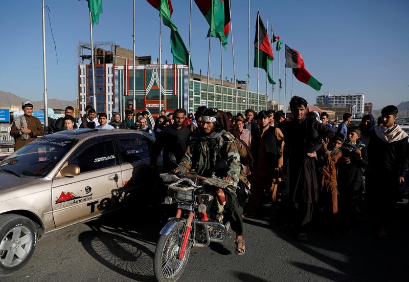 FILE PHOTO: Taliban on a motorbike ride among people in Kabul, Afghanistan June 16, 2018. REUTERS/Mohammad Ismail/File Photo