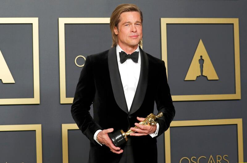 Best Supporting Actor Brad Pitt poses with the Oscar in the photo room during the 92nd Academy Awards in Hollywood. Reuters