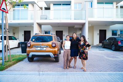 Mechelle Manuel (left) and her sisters Moj (centre) and Leny moved out of a two-bedroom apartment in Town Square, Dubai, after facing a 15 per cent rent increase. They moved further to the city outskirts for better value. Photo: Mechelle Manuel

