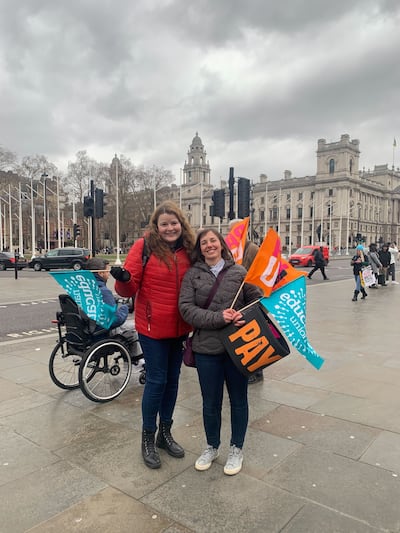 Striking teachers Rachel Claughan and Lisa Laverick pose with flags in Parliament Square, Westminster, following a protest. The National