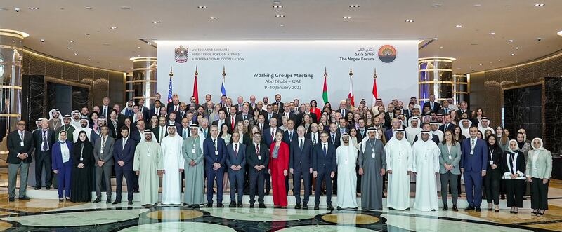 Officials from the UAE, Bahrain, Egypt, Israel, Morocco and the US pose for a photo during the first working groups meeting of the Negev Forum in Abu Dhabi. AFP