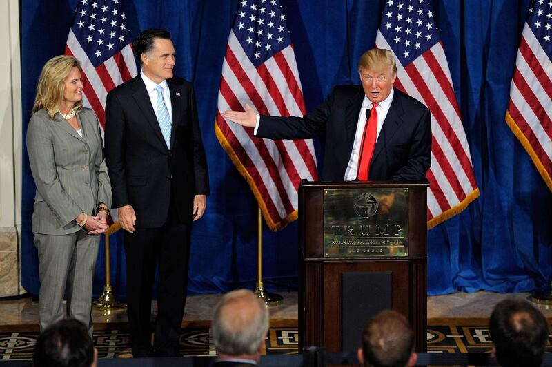 LAS VEGAS, NV - FEBRUARY 02: (L-R) Ann Romney and Republican presidential candidate, former Massachusetts Gov. Mitt Romney, look on as Donald Trump endorses Mitt Romney for president during a news conference at the Trump International Hotel & Tower Las Vegas February 2, 2012 in Las Vegas, Nevada. Romney came in first in the Florida primary on January 31 and is looking ahead to Nevada's caucus on February 4.   Ethan Miller/Getty Images/AFP