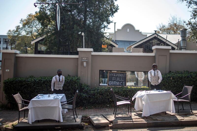 Staff members of a restaurant in Johannesburg demonstrate against the Covid-19 coronavirus lockdown regulations. AFP