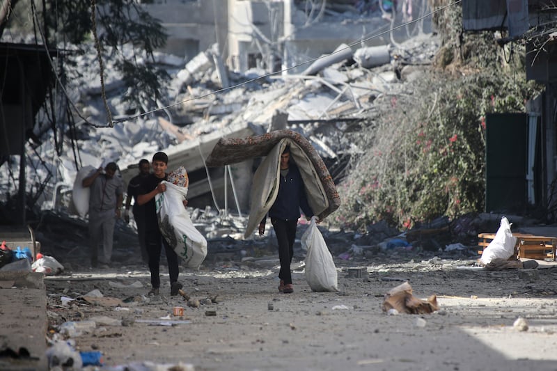 Palestinians displaced from their homes as a result of Israeli raids in Gaza City. Getty Images