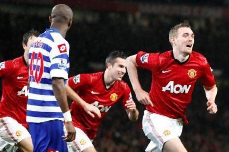 Manchester United's Darren Fletcher, right, marked his first Premier League game of the season with a goal against QPR. Jon Super / AP Photo