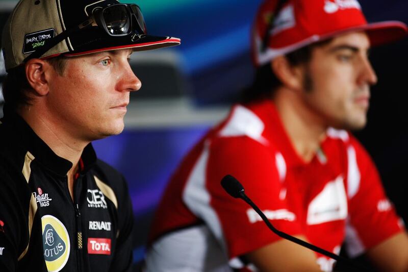 Kimi Raikkonen, left, will leave Lotus to partner Fernando Alonso, right, at Ferrari next season. Drew Gibson / Getty Images