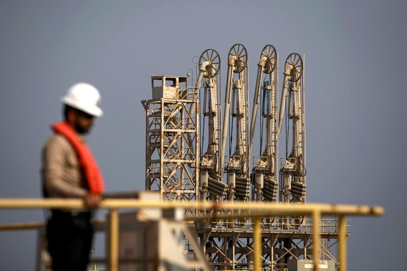 An employee looks out across oil pipes used for landing and unloading crude and refined oil at the North Pier Terminal, operated by Saudi Aramco, in Ras Tanura, Saudi Arabia, on Monday, Oct. 1, 2018. Saudi Aramco aims to become a global refiner and chemical maker, seeking to profit from parts of the oil industry where demand is growing the fastest while also underpinning the kingdom’s economic diversification. Photographer: Simon Dawson/Bloomberg