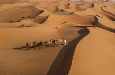 Camel trekking in the desert is available for guests. Photo: Anantara