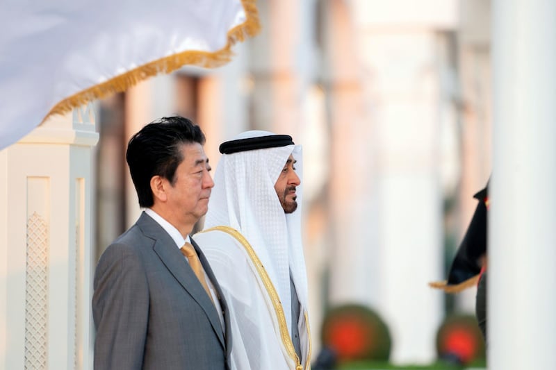 ABU DHABI, UNITED ARAB EMIRATES - January 13, 2020: HH Sheikh Mohamed bin Zayed Al Nahyan, Crown Prince of Abu Dhabi and Deputy Supreme Commander of the UAE Armed Forces (R) and HE Shinzo Abe, Prime Minister of Japan (L), stand for the national anthem during a reception, at Qasr Al Watan.

( Mohamed Al Hammadi / Ministry of Presidential Affairs )
---