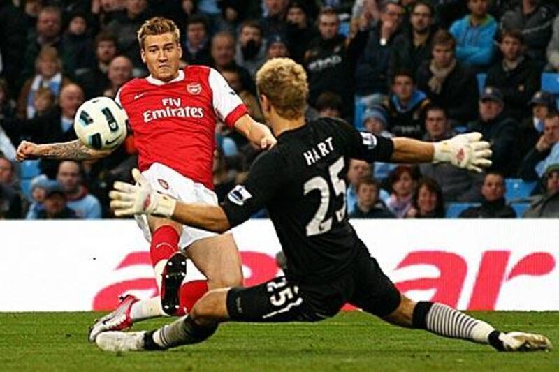 Nicklas Bendtner scores Arsenal’s third.