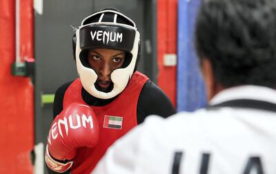 ABU DHABI,  UNITED ARAB EMIRATES , JUNE 16 – 2019 :- Khasan Mukhamedov , National team coach giving boxing training  to Hanan Ibrahim Alzyodi ( left )  at the UAE Boxing Federation HQ located at the Zayed Sports City Football stadium in Abu Dhabi. ( Pawan Singh / The National ) For Sport. Story by Amith