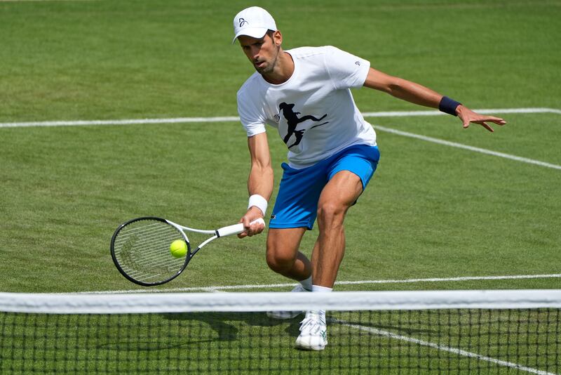 Serbia's Novak Djokovic plays a return as he practises ahead of the Wimbledon tennis championships in London, Sunday, June 26, 2022. AP 