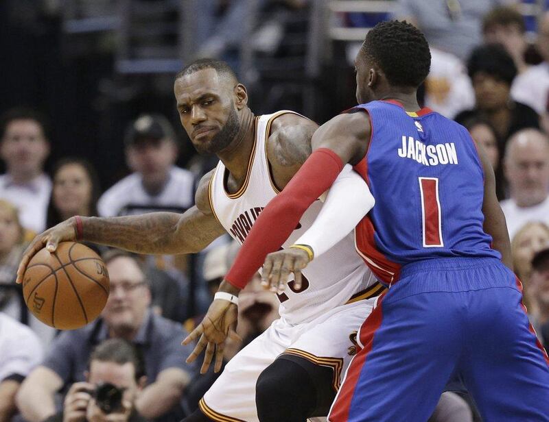 LeBron James of the Cleveland Cavaliers backs down Reggie Jackson of the Detroit Pistons during Game 1 of their NBA play-offs series on Sunday night. Tony Dejak / AP / April 17, 2016 