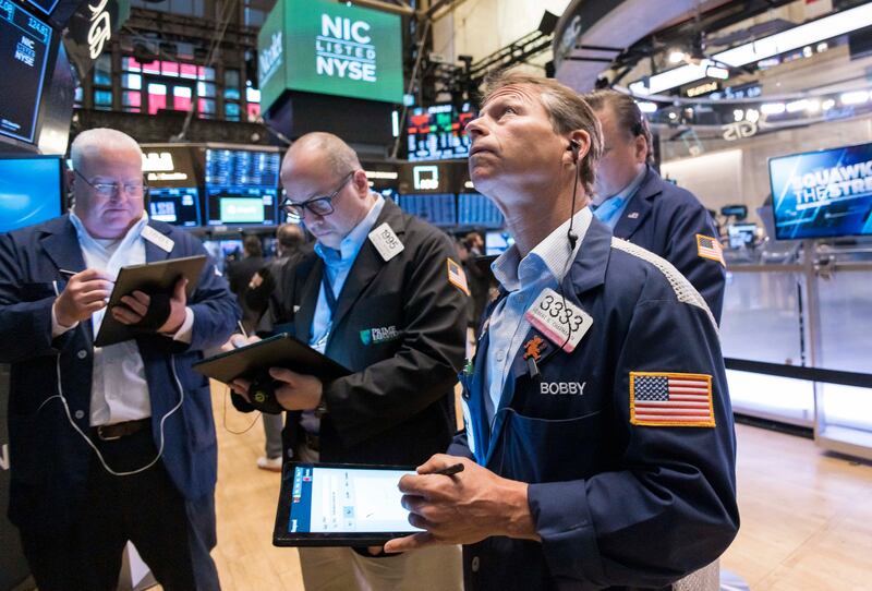Traders work on the floor of the New York Stock Exchange. Wall Street stocks enjoyed another session entirely in positive territory. EPA