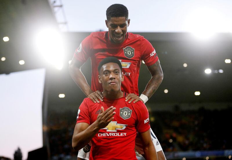 Manchester United's Anthony Martial celebrates scoring their first goal with teammate Marcus Rashford. AFP