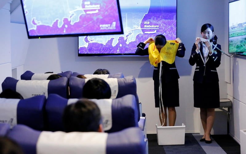 Fight attendants perform a safety demonstration despite the plane never taking off.