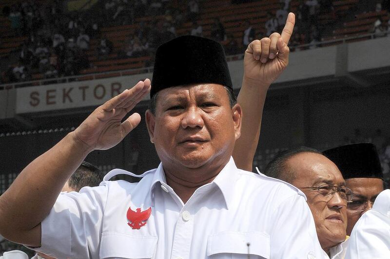 Indonesia's presidential candidate Prabowo Subianto salutes supporters during campaign rally in Jakarta on June 22,2014.  Subianto, 62, ordered the abduction of democracy activists in the dying days of dictator Suharto's rule, was once refused entry to the US over rights abuses, and used to be married to one of the strongman's daughters. Romeo Gacad/AFP Photo

