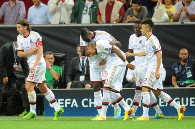 Kevin-Prince Boateng scored twice to power AC Milan to the Champions League group stage.