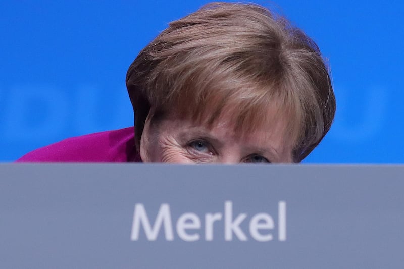 Angela Merkel returns to her seat after addressing the CDU party conference in Berlin, Germany, February 26, 2018. Bloomberg