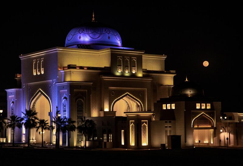 The biggest and brightest supermoon of the year shows itself at the Qasr Al Watan Palace in Abu Dhabi on May 26, 2021. Victor Besa / The National.