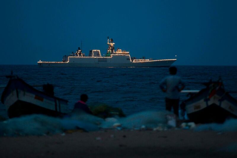 An Indian navy ship anchored off coast of Marina beach is illuminated to pay tribute to people fighting against the spread of the coronavirus, in Chennai. AFP
