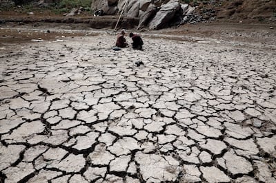 A drought-hit reservoir in Sanaa, Yemen. An ICRC report in May warned the combined effects of climate change and armed conflict were creating an alarming mix of humanitarian crises in the Middle East. EPA 