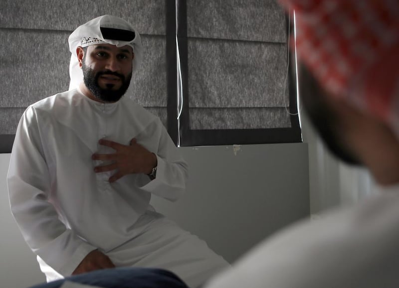 Emirati psychologist Naser Al Riyami, who uses hypnotherapy to treat smoking and other addictions, works with a client at his office in Abu Dhabi. Ravindranath K / The National 