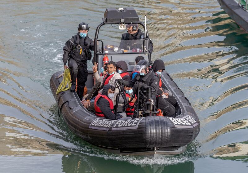 Border Force officials escorted people on boats crossing the English Channel from France to Dover, England, on June 29. EPA
