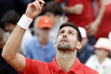 Novak Djokovic of Serbia celebrates after winning the men's second round match against Alex Molcan of Slovakia during the French Open tennis tournament at Roland Garros in Paris, France, 25 May 2022.  Djokovic won in three sets.   EPA / CHRISTOPHE PETIT TESSON