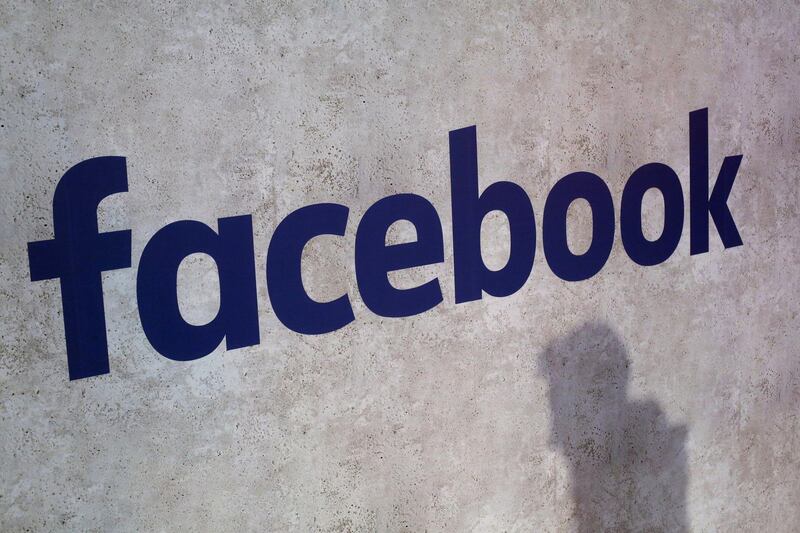 FILE - This Jan. 17, 2017, file photo shows a Facebook logo displayed at a business gathering in Paris. Facebook is reportedly in talks with news publishers to offer â€œmillions of dollarsâ€ for the rights to publish their material on its site amid years-long criticism over its apparent role in taking away online advertising dollars from the struggling industry. (AP Photo/Thibault Camus, File)