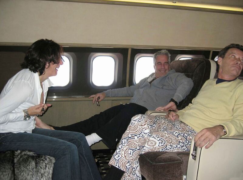 Jean-Luc Brunel, right, with Jeffrey Epstein, centre and the financier's girlfriend Ghislaine Maxwell, on a private jet. Shutterstock