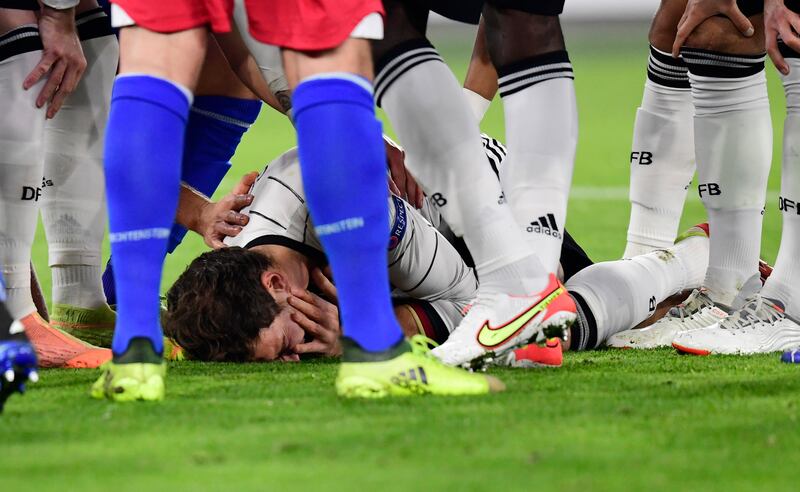 Germany's Leon Goretzka down injured. Reuters