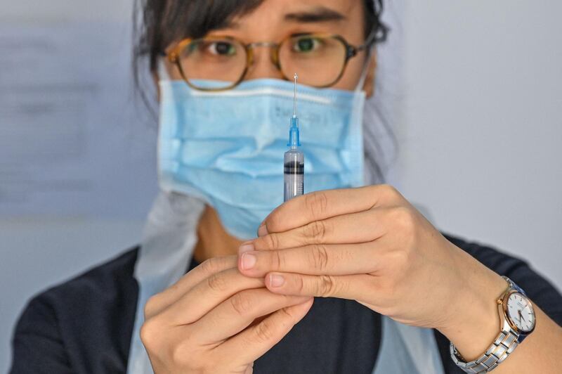 A medic prepares to administer a dose of the Sinovac Covid-19 vaccine in Kuala Lumpur, Malaysia. AFP