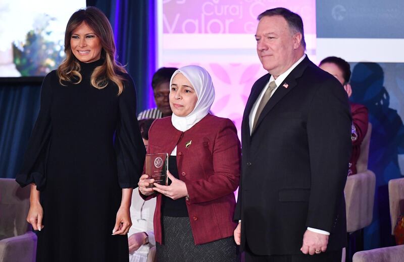 International Women of Courage Award recipient Amina Khoulani of Syria poses with US Secretary of State Mike Pompeo and First Lady Melania Trump at the State Department in Washington.  AFP