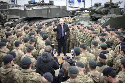 TALLINN, ESTONIA - DECEMBER 21:  Prime Minister Boris Johnson speaks to British troops stationed in Estonia during a one-day visit to the Baltic country on December 21, 2019 in Tallinn, Estonia. The base is home to 850 British troops from the Queen's Royal Hussars who lead the Nato battlegroup along with personnel from Estonia, France and Denmark. (Photo by Stefan Rousseau - Pool/Getty Images)