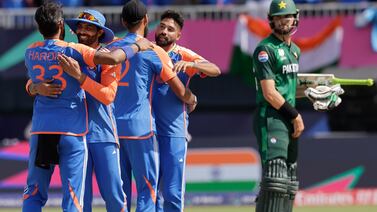 Pakistan's Shaheen Shah Afridi, right, watches as Indian players celebrate their win in the ICC Men's T20 World Cup cricket match between India and Pakistan at the Nassau County International Cricket Stadium in Westbury, New York, Sunday, June 9, 2024.  (AP Photo / Adam Hunger)