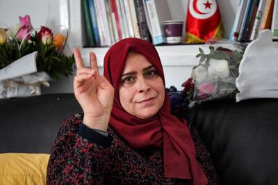 Faiza Bouhlel, member of parliament for Ennahdha party, shows the victory symbol while she takes part in a hunger strike against the president. Photo: AFP