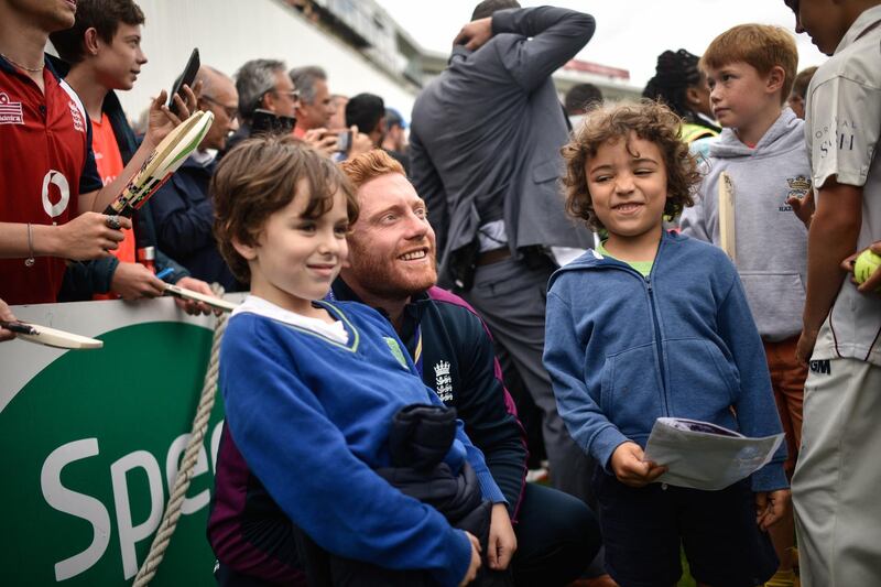 Jonny Bairstow takes a photo with school children during the England ICC World Cup Victory Celebration at The Kia Oval in London, England. Getty Images