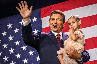 Republican gubernatorial candidate for Florida Ron DeSantis holds his daughter Mamie during an election night watch party at the Convention Center in Tampa, Florida, on November 8, 2022.  - Florida Governor Ron DeSantis, who has been tipped as a possible 2024 presidential candidate, was projected as one of the early winners of the night in Tuesday's midterm election.  (Photo by Giorgio VIERA  /  AFP)