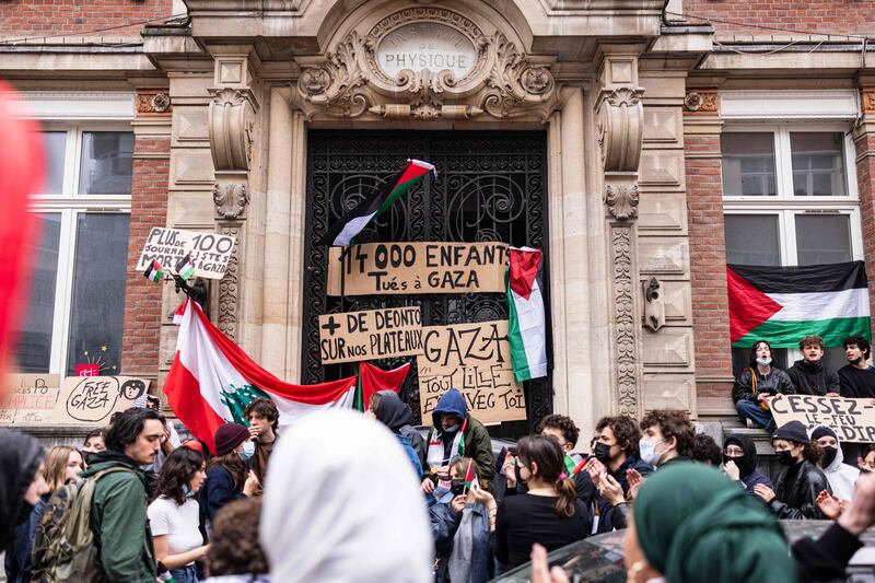 Students block the entrance of the ESJ Superior School of Journalism in Lille, northern France. AFP