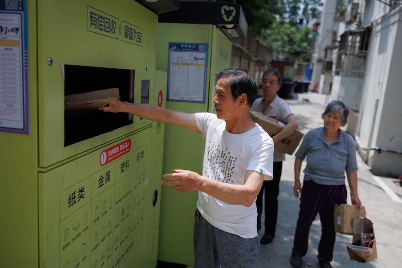 A front-end recycling machine at a residential compound in Shanghai. Compared to traditional recycling bins, residents are rewarded with a small amount of money after separating waste and placing it in the machines. EPA