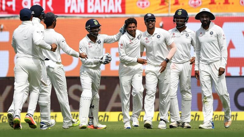 India's Kuldeep Yadav, centre, celebrates the wicket of Australia batsman Glenn Maxwell at Dharamshala on Saturday. Prakash Singh / AFP