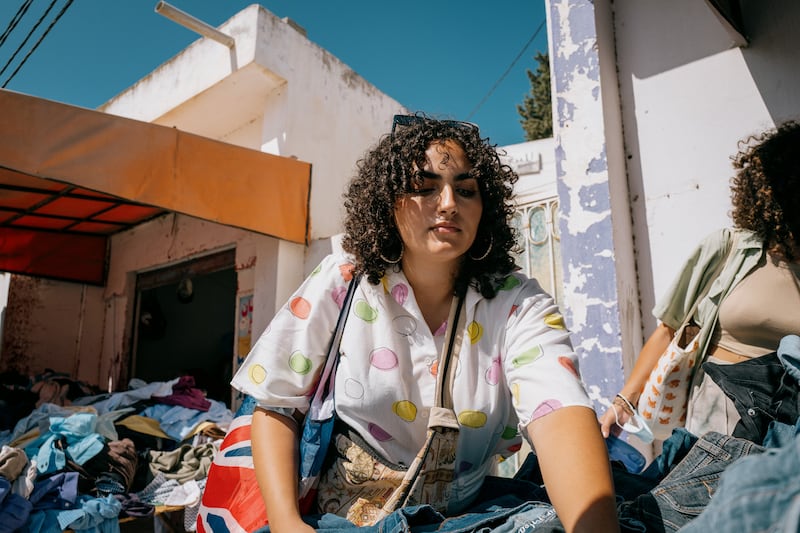 The thrill of the hunt — digging for the perfect vintage denim in one of Tunis' fripes.  Photo: Erin Clare Brown / The National