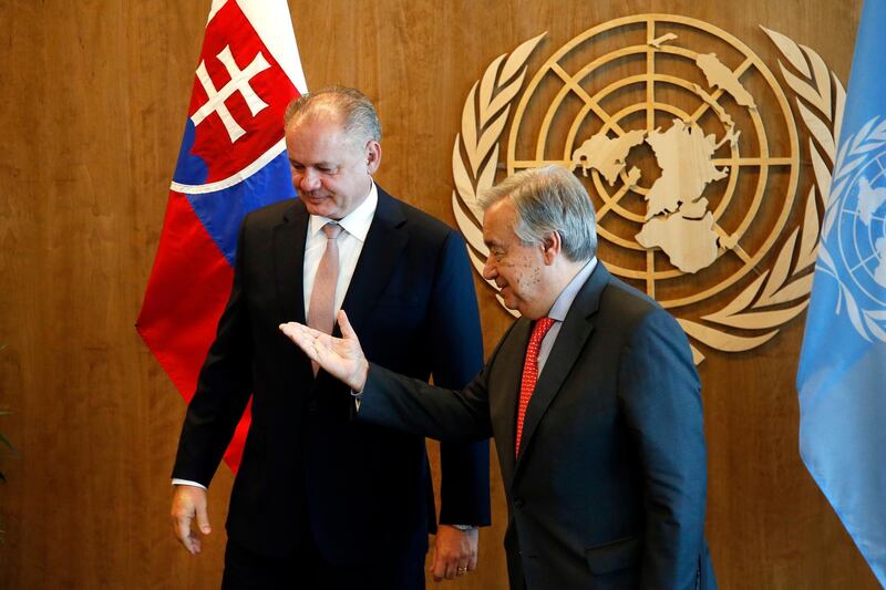 Slovakia's President Andrej Kiska, is directed towards the guest book by United Nations Secretary-General Antonio Guterres as they meet on the sidelines of the United Nations General Assembly. AP